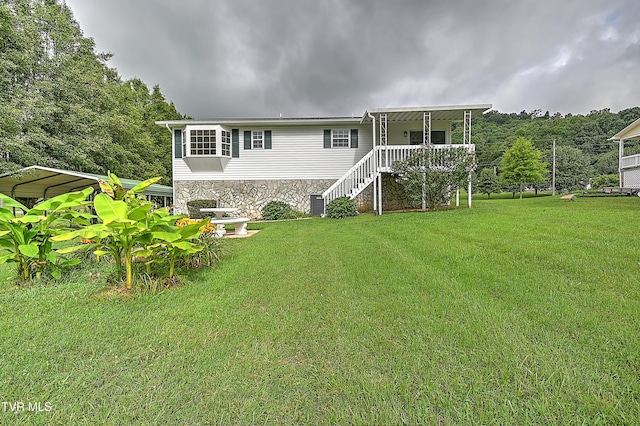4970 Old Stage Rd, Chuckey, TN 37641 - back of property featuring a carport, a lawn, stairs, and stone siding