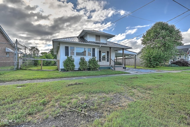 810 N Roan St, Elizabethton, TN 37643 - view of front of property with a porch, a metal roof, a carport, and a standing seam roof