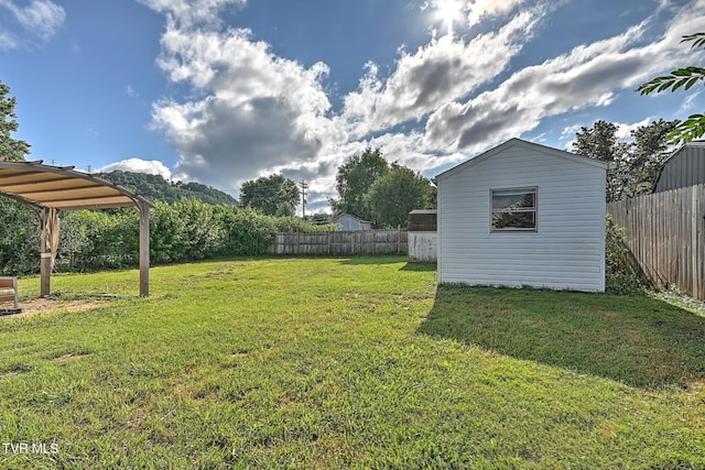 810 N Roan St, Elizabethton, TN 37643 - fenced backyard with an outbuilding