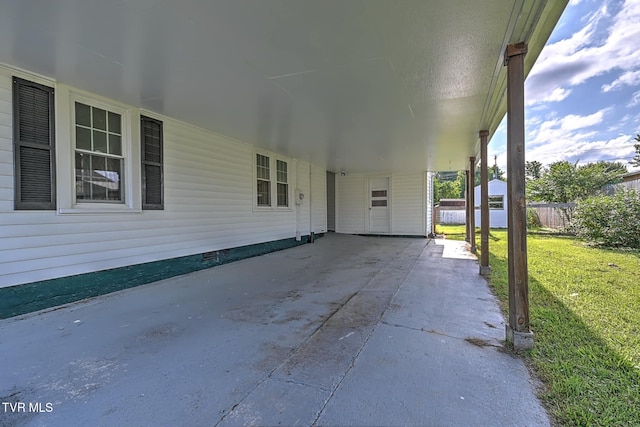 810 N Roan St, Elizabethton, TN 37643 - view of patio / terrace featuring an attached carport and a shed
