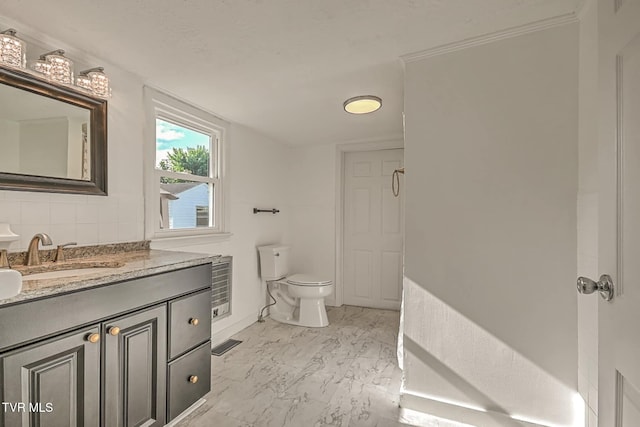 810 N Roan St, Elizabethton, TN 37643 - bathroom featuring vanity, marble finish floors, and backsplash