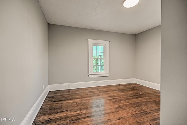 810 N Roan St, Elizabethton, TN 37643 - spare room featuring wood finished floors and baseboards