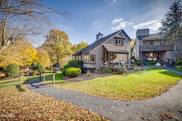 13 Crown Cir, Kingsport, TN 37660 - view of property exterior with an outdoor living space, a yard, a chimney, and a wooden deck
