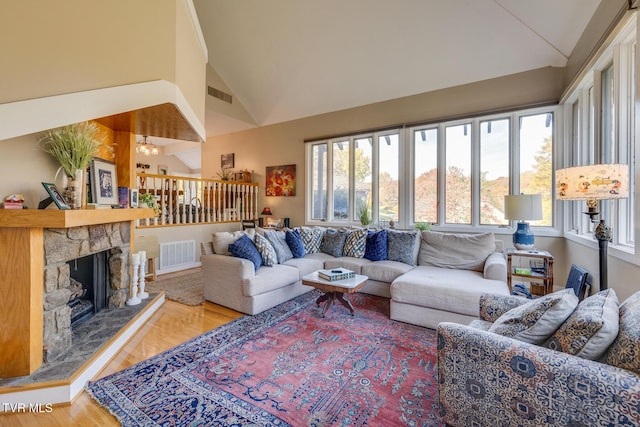 13 Crown Cir, Kingsport, TN 37660 - living room with wood finished floors, high vaulted ceiling, and a stone fireplace