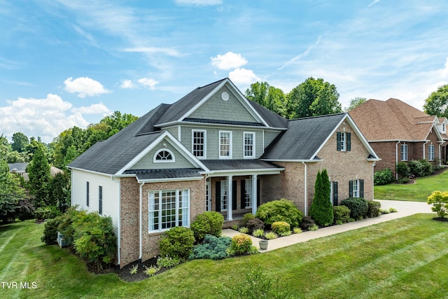 2003 Hackberry Dr, Jonesborough, TN 37659 - view of front of property with brick siding, a front lawn, covered porch, and roof with shingles