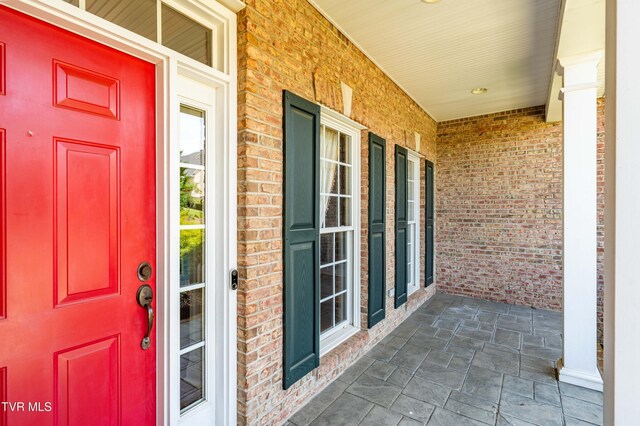 2003 Hackberry Dr, Jonesborough, TN 37659 - view of exterior entry with a porch and brick siding