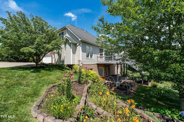2003 Hackberry Dr, Jonesborough, TN 37659 - view of property exterior with a lawn, a deck, a garage, and brick siding