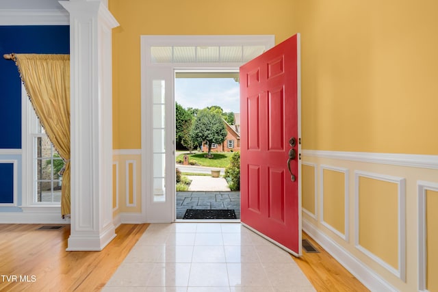 2003 Hackberry Dr, Jonesborough, TN 37659 - foyer with ornate columns, a decorative wall, wainscoting, and light wood finished floors