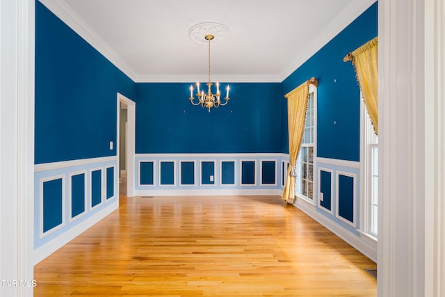 2003 Hackberry Dr, Jonesborough, TN 37659 - spare room featuring a chandelier, ornamental molding, and wood finished floors