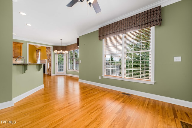 2003 Hackberry Dr, Jonesborough, TN 37659 - unfurnished living room featuring a chandelier, ornamental molding, a ceiling fan, light wood-style flooring, and recessed lighting