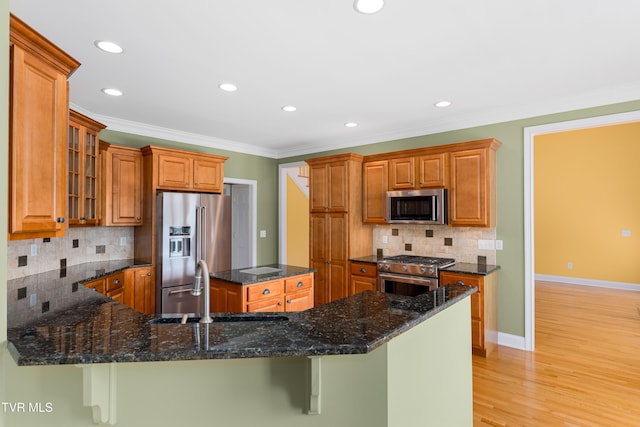2003 Hackberry Dr, Jonesborough, TN 37659 - kitchen with high quality appliances, decorative backsplash, dark stone countertops, recessed lighting, and ornamental molding
