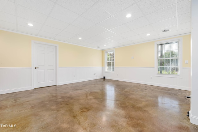 2003 Hackberry Dr, Jonesborough, TN 37659 - spare room with a wainscoted wall, finished concrete flooring, plenty of natural light, and a paneled ceiling