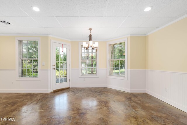2003 Hackberry Dr, Jonesborough, TN 37659 - unfurnished dining area featuring concrete flooring, a wainscoted wall, a chandelier, and crown molding