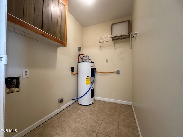2613 Rockwell Pl, Kingsport, TN 37664 - laundry room with electric water heater, light tile patterned flooring, and cabinet space