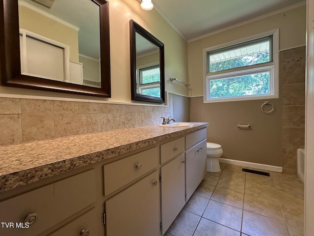 2613 Rockwell Pl, Kingsport, TN 37664 - bathroom featuring vanity, crown molding, a wainscoted wall, and tile patterned flooring