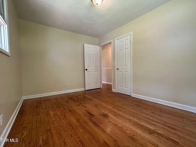 2613 Rockwell Pl, Kingsport, TN 37664 - unfurnished bedroom with wood finished floors and a textured ceiling