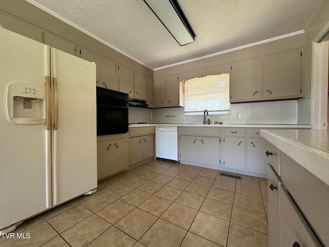 2613 Rockwell Pl, Kingsport, TN 37664 - kitchen with white appliances, a textured ceiling, crown molding, light countertops, and light tile patterned floors