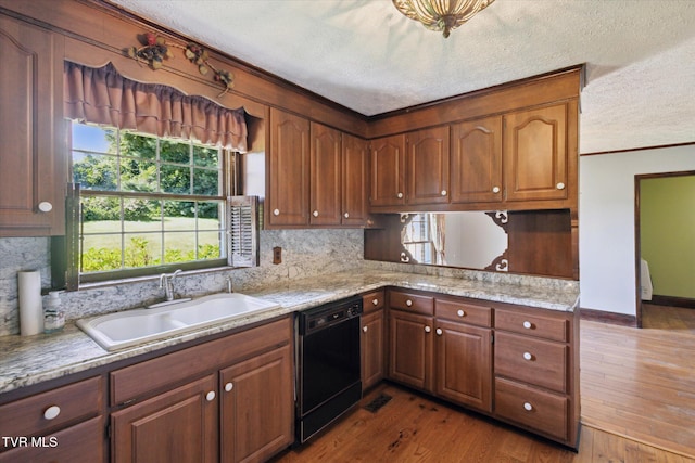 15493 Siesta Ave, Bristol, VA 24202 - kitchen with black dishwasher, a textured ceiling, ornamental molding, decorative backsplash, and wood finished floors