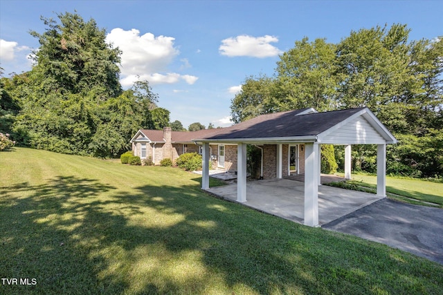 15493 Siesta Ave, Bristol, VA 24202 - view of green lawn with driveway and an attached carport