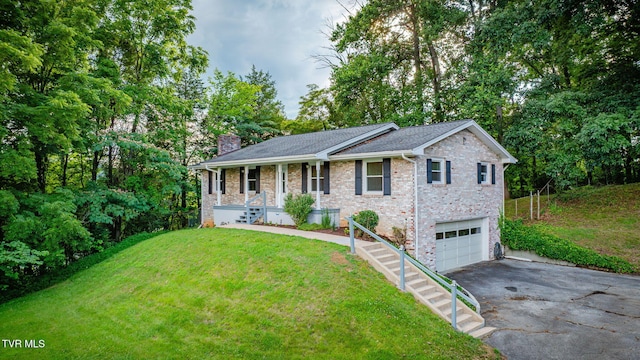 3513 Crest Rd, Kingsport, TN 37664 - ranch-style home with asphalt driveway, an attached garage, a chimney, covered porch, and a front yard