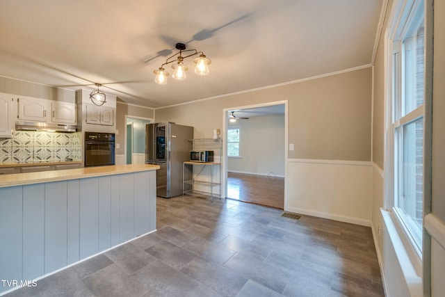 3513 Crest Rd, Kingsport, TN 37664 - kitchen with stainless steel refrigerator with ice dispenser, black oven, backsplash, under cabinet range hood, and light countertops
