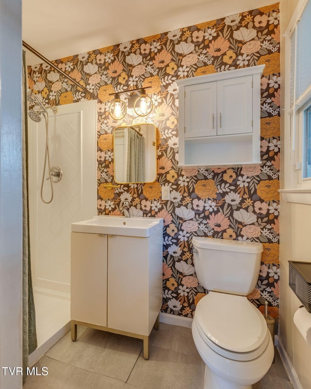 3513 Crest Rd, Kingsport, TN 37664 - bathroom with wallpapered walls, tiled shower, vanity, and tile patterned flooring