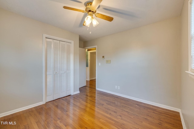 3513 Crest Rd, Kingsport, TN 37664 - unfurnished bedroom featuring wood finished floors, a closet, and a ceiling fan