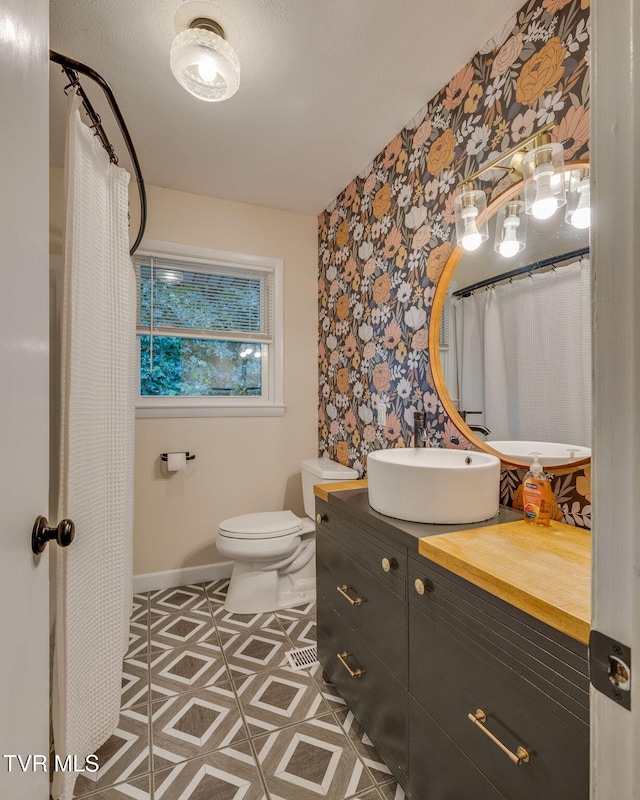 3513 Crest Rd, Kingsport, TN 37664 - full bathroom featuring wallpapered walls, an accent wall, vanity, and tile patterned floors