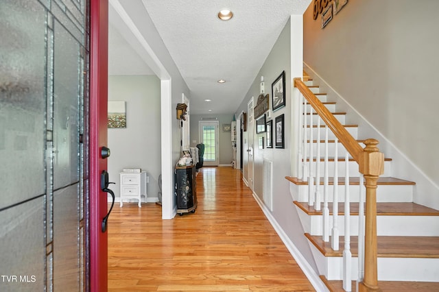 563 Old Jonesboro Rd, Bristol, TN 37620 - entryway with light wood finished floors, stairway, a textured ceiling, and recessed lighting