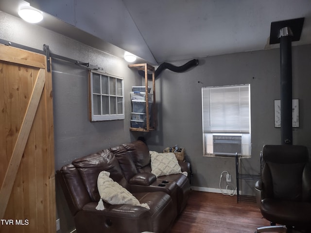 9060 Stillmeadows Ln, Meadowview, VA 24361 - living room with wood finished floors, a barn door, cooling unit, and vaulted ceiling