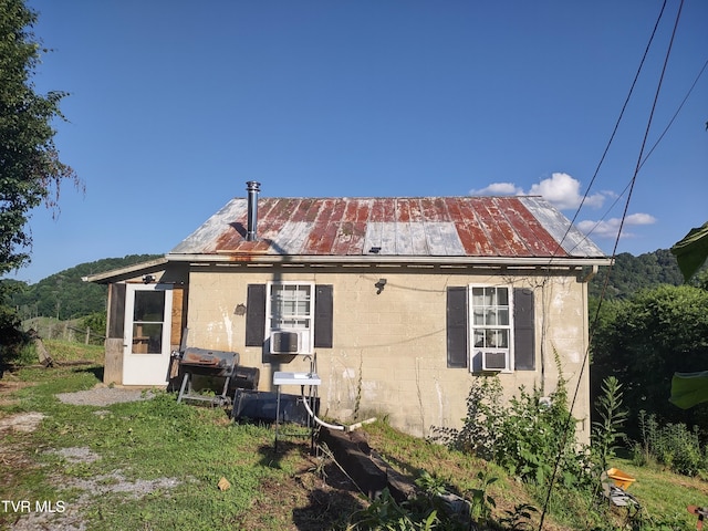 9060 Stillmeadows Ln, Meadowview, VA 24361 - rear view of house with concrete block siding, a metal roof, and a standing seam roof