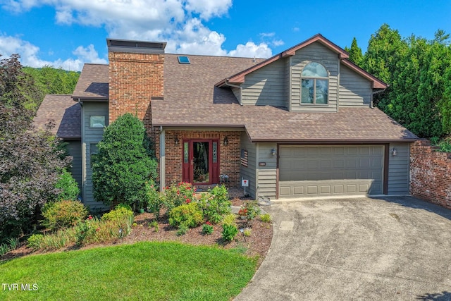 223 Willowbend Ct, Kingsport, TN 37660 - view of front of home with a garage, a shingled roof, concrete driveway, a chimney, and a front lawn