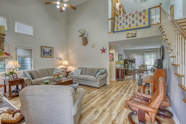 223 Willowbend Ct, Kingsport, TN 37660 - living area featuring a high ceiling, a ceiling fan, stairway, and light wood-style flooring