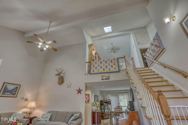 223 Willowbend Ct, Kingsport, TN 37660 - living area with a ceiling fan, high vaulted ceiling, stairs, and beam ceiling