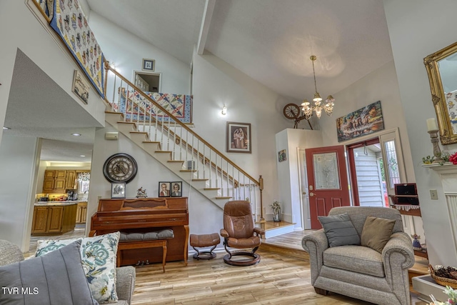 223 Willowbend Ct, Kingsport, TN 37660 - foyer featuring high vaulted ceiling, stairway, a chandelier, and light wood-style flooring