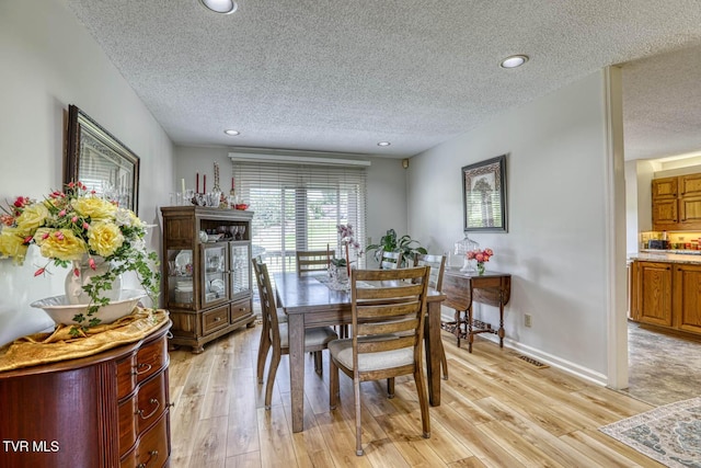 223 Willowbend Ct, Kingsport, TN 37660 - dining room with a textured ceiling, light wood-type flooring, and recessed lighting