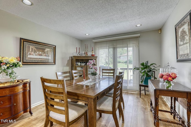 223 Willowbend Ct, Kingsport, TN 37660 - dining room with light wood-style flooring, a textured ceiling, and recessed lighting