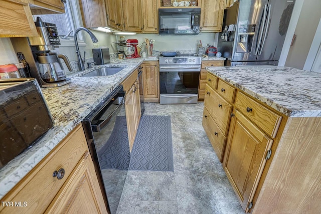 223 Willowbend Ct, Kingsport, TN 37660 - kitchen with black appliances, light stone countertops, and brown cabinetry