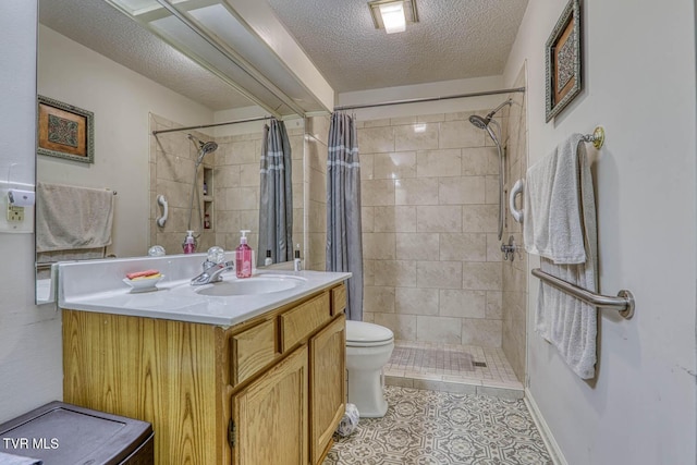 223 Willowbend Ct, Kingsport, TN 37660 - full bathroom featuring a textured ceiling, vanity, tiled shower, and tile patterned flooring