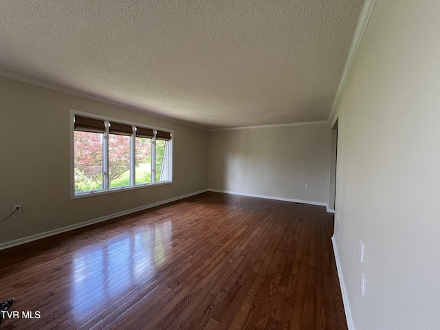 1232 Caribbean Dr, Kingsport, TN 37660 - spare room featuring ornamental molding, a textured ceiling, and dark wood-style flooring