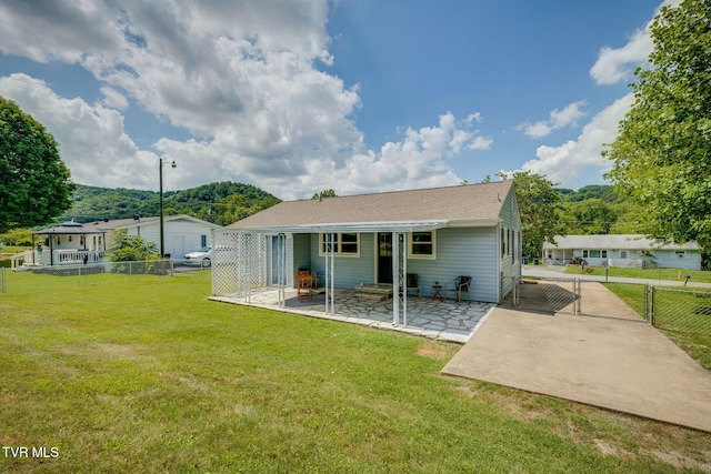 203 Hickory Rd, Bristol, TN 37620 - back of property with a gate, a patio area, and a fenced backyard