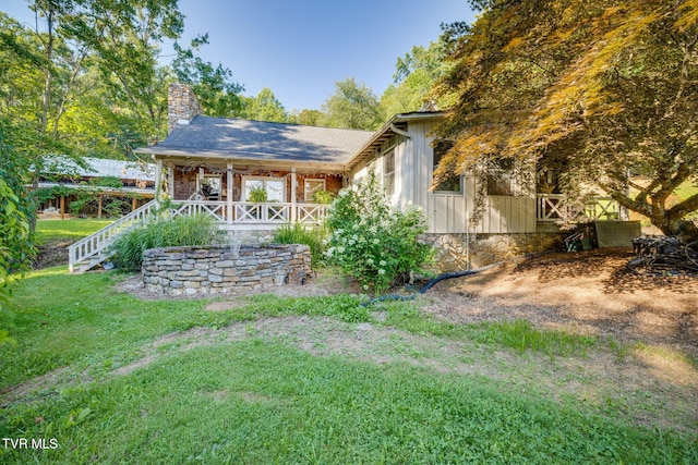 284 Bulldog Holw, Elizabethton, TN 37643 - back of property with a chimney, a yard, stairs, and board and batten siding
