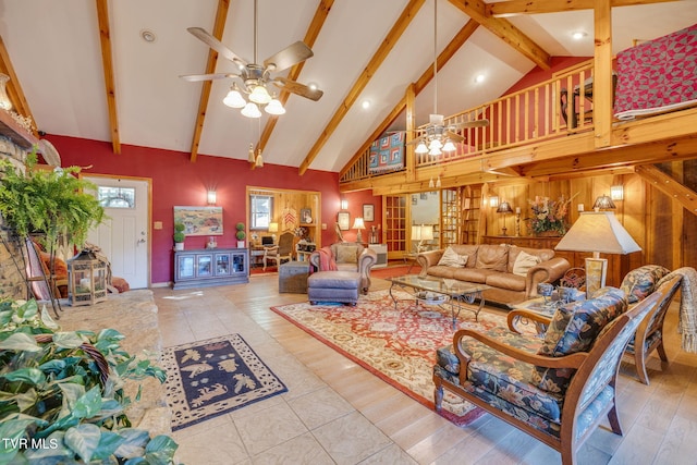 284 Bulldog Holw, Elizabethton, TN 37643 - living room with high vaulted ceiling, beamed ceiling, ceiling fan, wood walls, and a chandelier