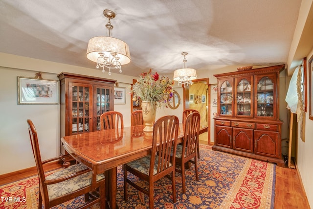 284 Bulldog Holw, Elizabethton, TN 37643 - dining area featuring a chandelier, light wood-style flooring, and lofted ceiling