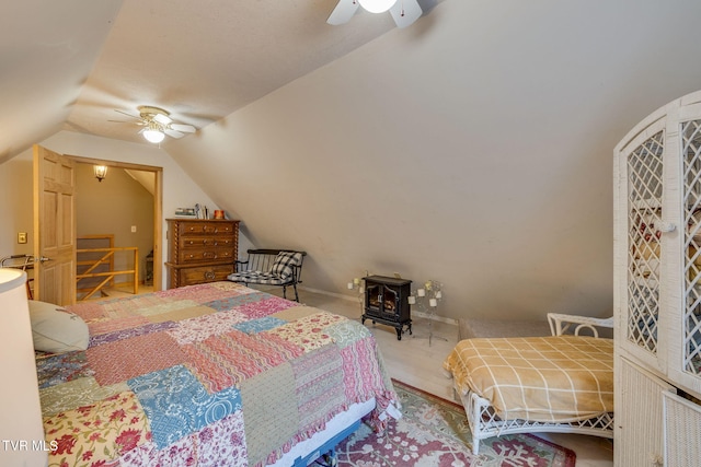 284 Bulldog Holw, Elizabethton, TN 37643 - bedroom featuring lofted ceiling, a ceiling fan, and a wood stove