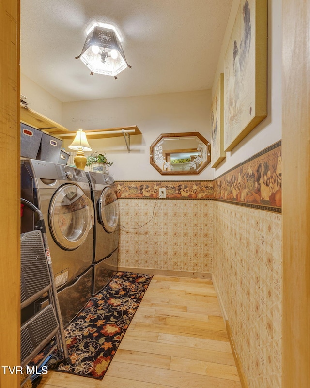 284 Bulldog Holw, Elizabethton, TN 37643 - washroom featuring washer and dryer, hardwood / wood-style floors, wainscoting, and wallpapered walls