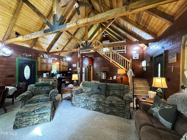 1014 Lightnen Rd, Parrottsville, TN 37843 - carpeted living room with wooden walls, stairway, a wood ceiling with exposed beams, and high vaulted ceiling