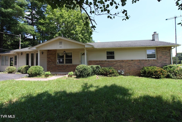 288 Hicks Rd, Piney Flats, TN 37686 - single story home featuring brick siding, a chimney, and a front yard