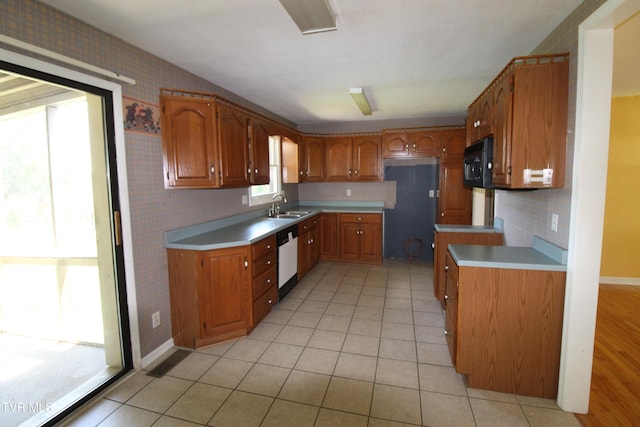 288 Hicks Rd, Piney Flats, TN 37686 - kitchen featuring black microwave, brown cabinets, white dishwasher, and light tile patterned floors