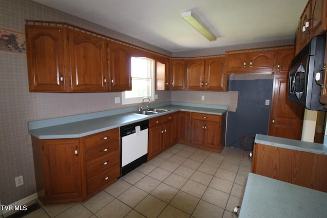 288 Hicks Rd, Piney Flats, TN 37686 - kitchen featuring white dishwasher, wallpapered walls, brown cabinets, stainless steel microwave, and light countertops